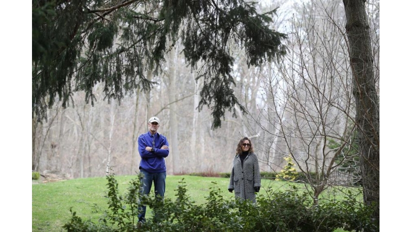 Richard Reid and his wife, Lori De Luca Reid, outside of their house in Toronto on Tuesday. Richard was on a ventilator but after his release remains COVID-positive, so Lori is distancing herself from her husband. 