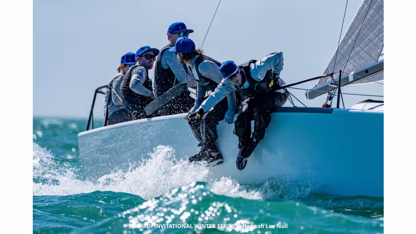 Laura Grondin and Taylor Canfield sitting in the cockpit racing Dark Energy USA864 at the Bacardi Invitational Winter Series 2024