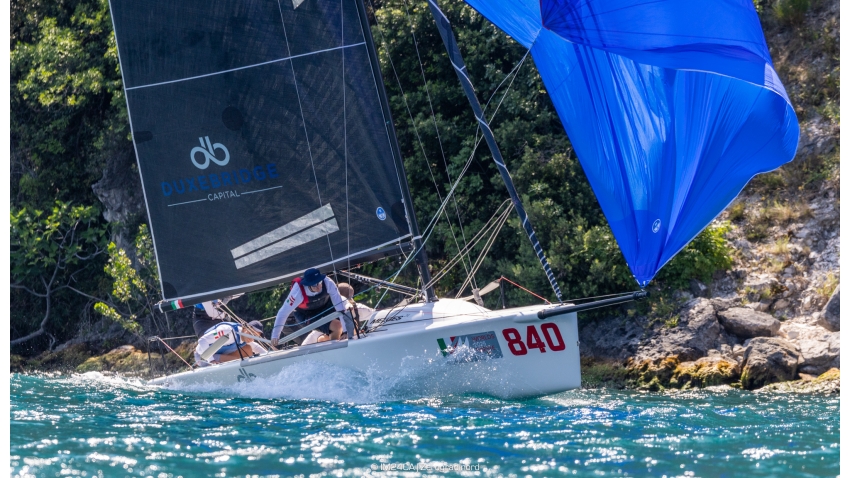 TOP GUN ITA840 by Benjamin Stilfried on the course framed by the cliffs surrounding the northern end of Lake Garda