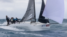 War Canoe USA825 of Michael Goldfarb surfing the waves at the Melges 24 World Championship 2022 in Fort Lauderdale, USA